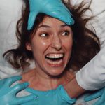 Woman in hospital bed screaming